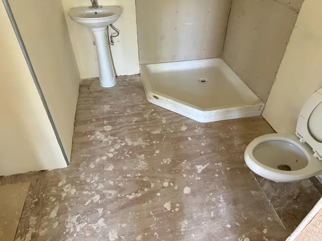 a bathroom with a sink and shower
