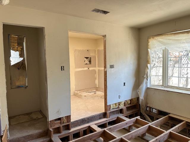 413 South 5th Street Fowler, CA 93625 - Photo 10 of 18 a room with wooden floor and a window
