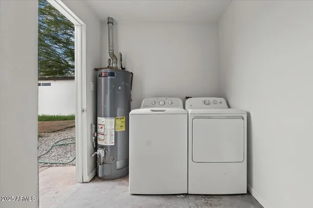a utility room with dryer and washer