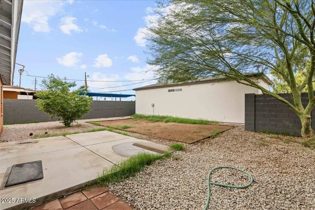 a backyard of a house with lots of green space