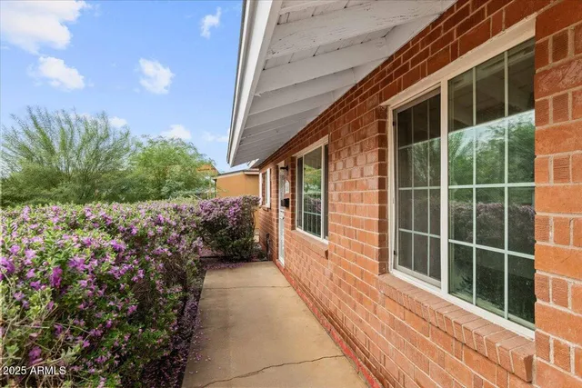 a view of a pathway besides a house