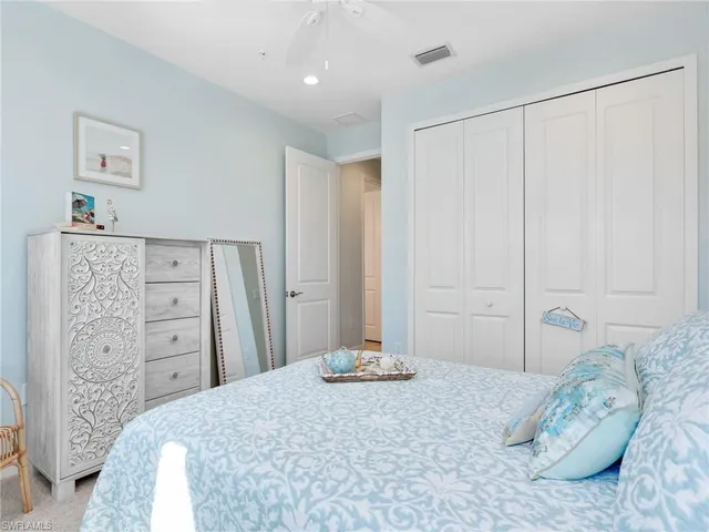 a bedroom with a bed and a walk in closet