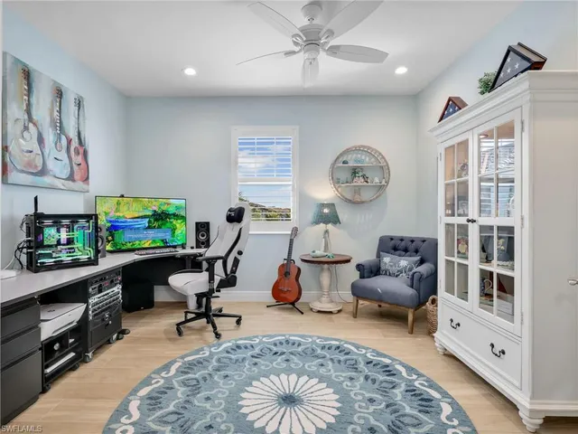 a living room with furniture a rug and a window