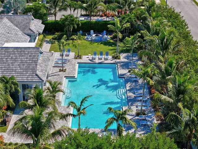 a front view of a house with swimming pool and porch