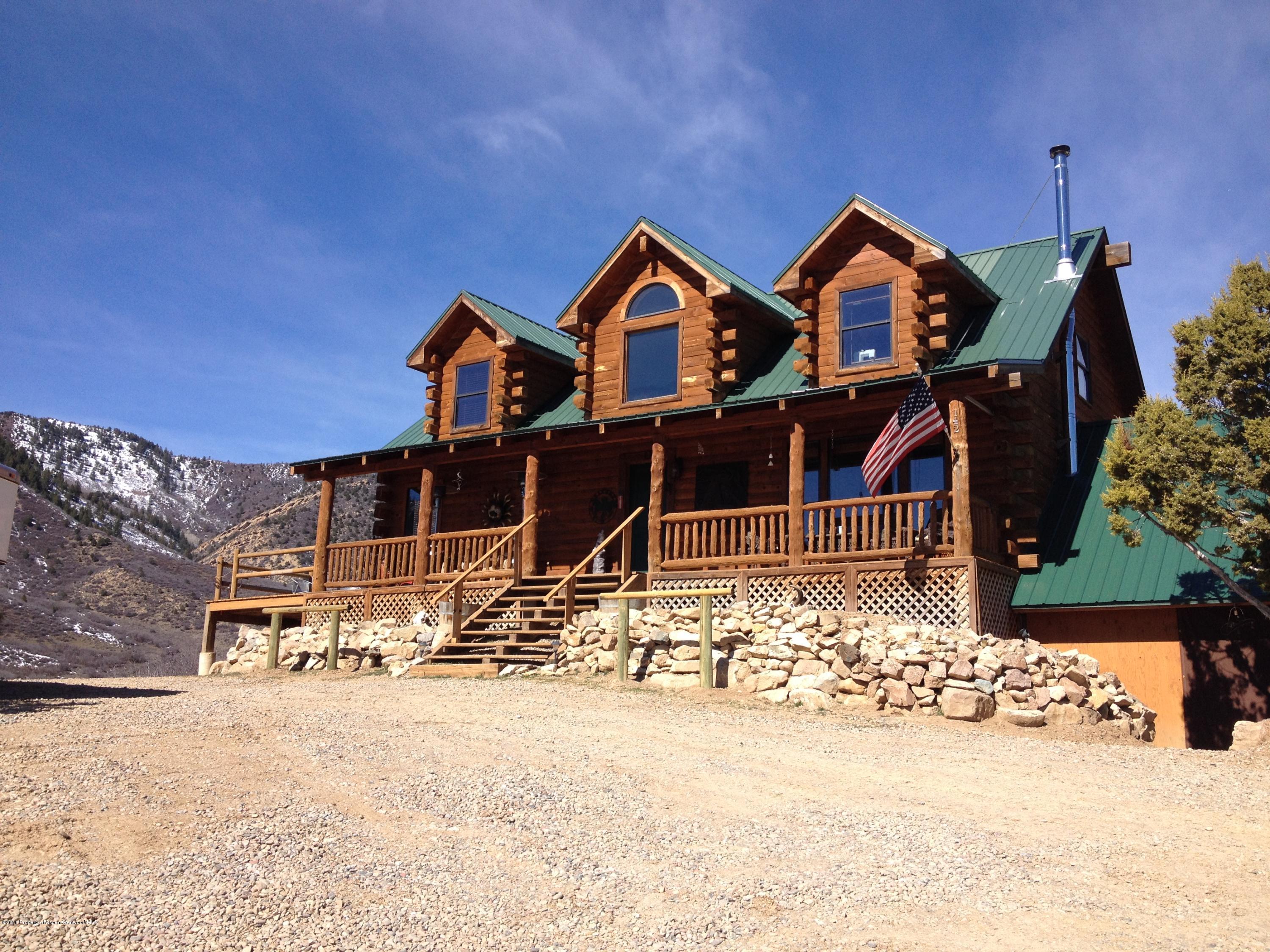 a front view of a house with parking space