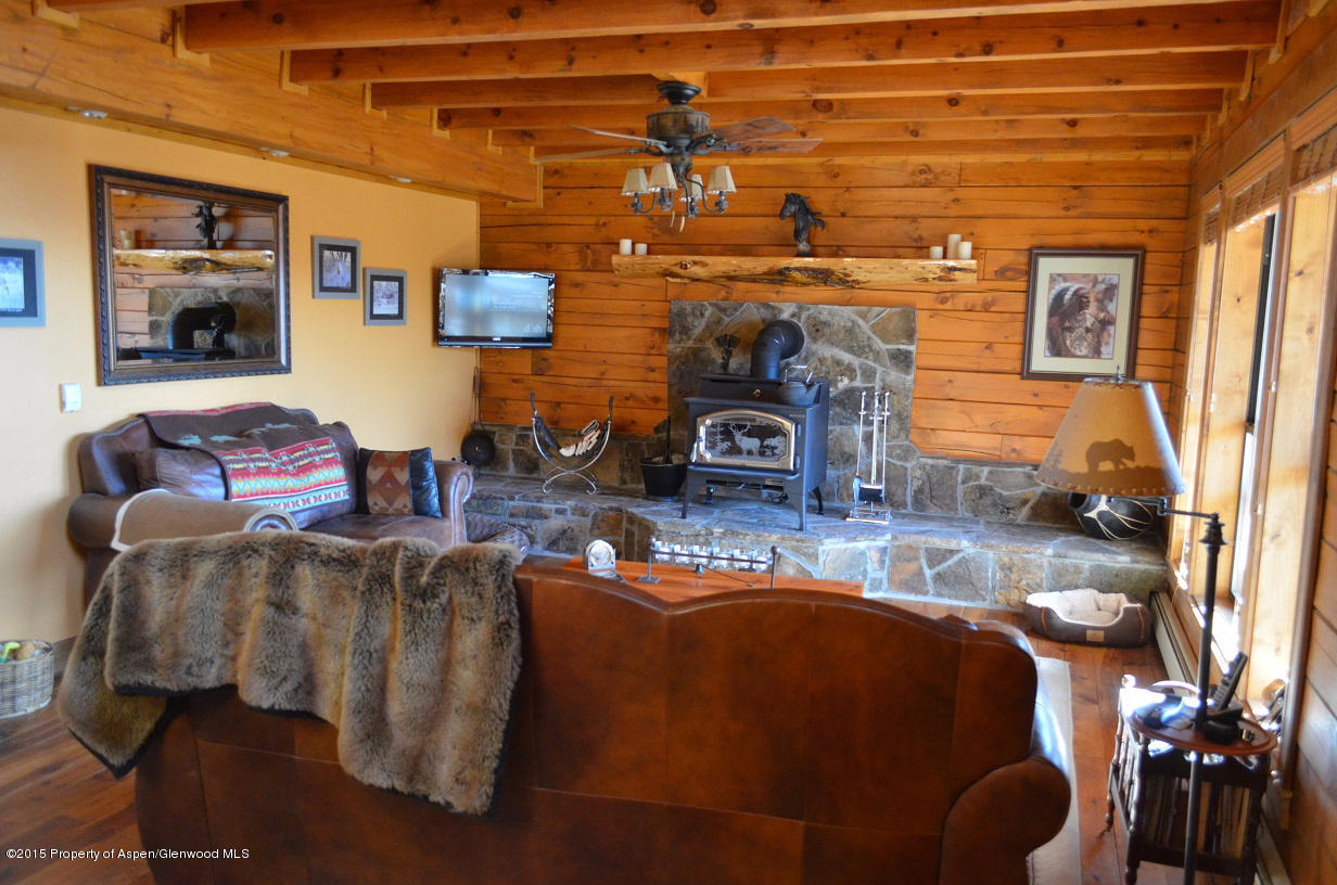 142 Happy Dog Trail Rifle, CO 81650 - Photo 18 of 39 a living room with furniture and a fireplace