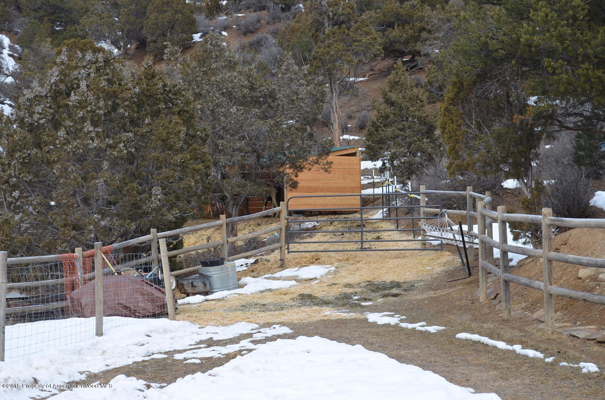142 Happy Dog Trail Rifle, CO 81650 - Photo 22 of 39 a view of a swimming pool with a chair and tables