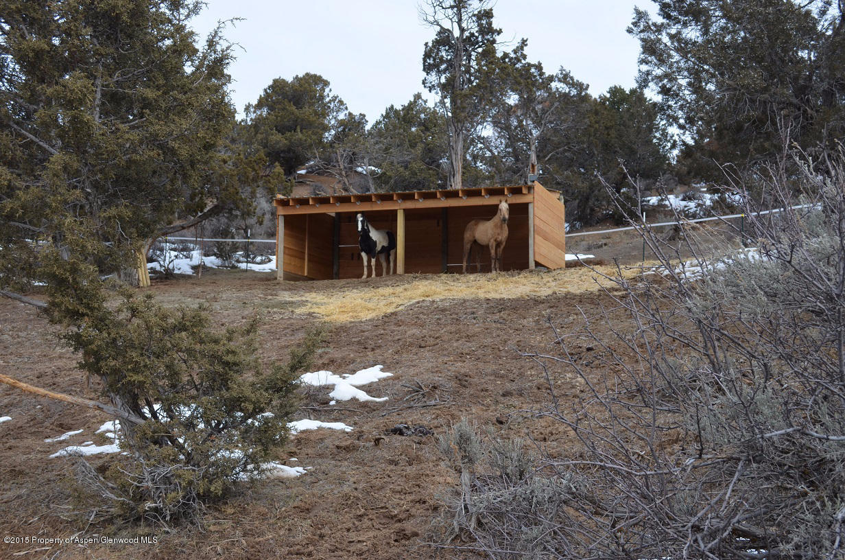 142 Happy Dog Trail Rifle, CO 81650 - Photo 24 of 39 a view of a house with a yard