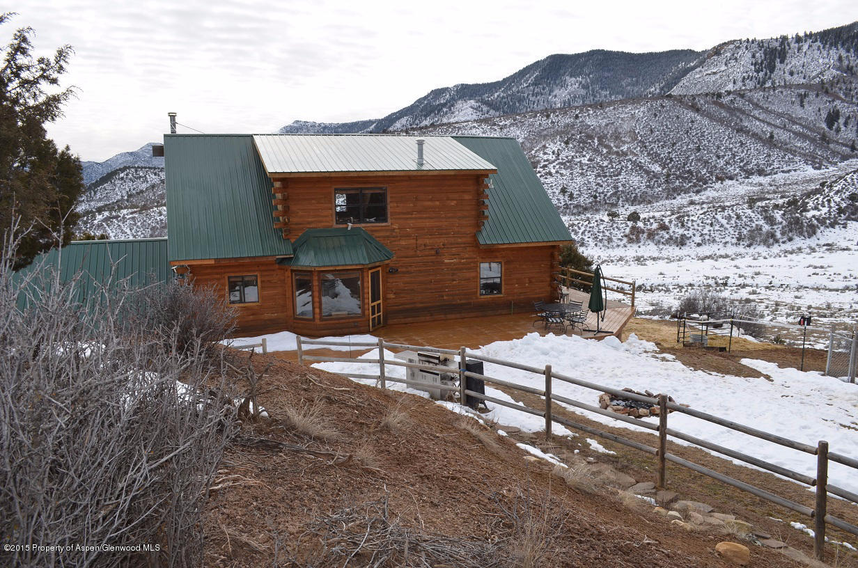 142 Happy Dog Trail Rifle, CO 81650 - Photo 26 of 39 an aerial view of a house with a yard and a large tree