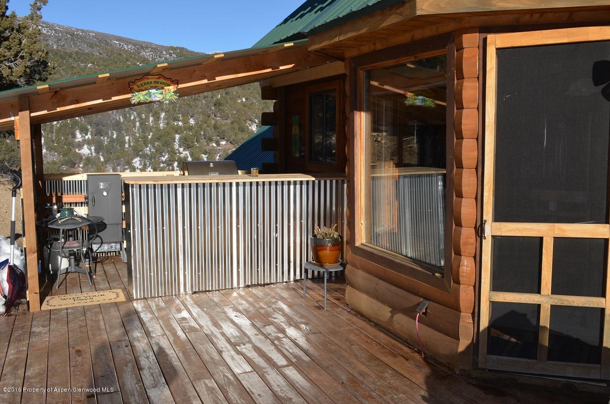 142 Happy Dog Trail Rifle, CO 81650 - Photo 31 of 39 a view of a balcony with floor to ceiling window and wooden floor