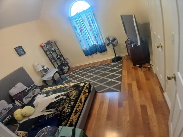 a room with gym equipment and a rug