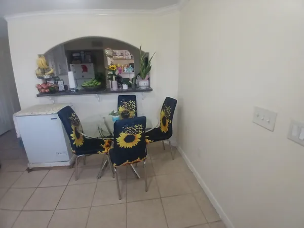 a dining room with furniture and window