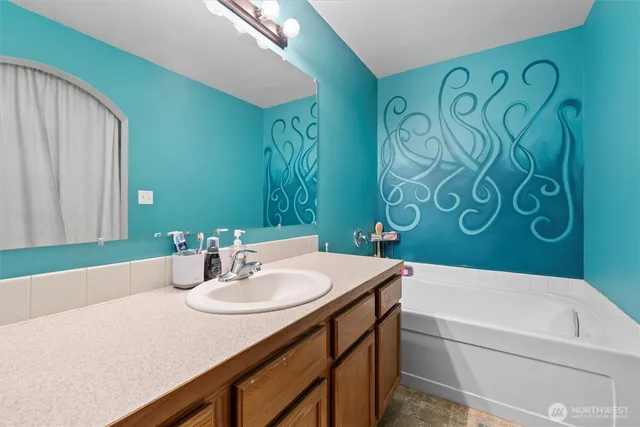 a bedroom with a bed and dresser