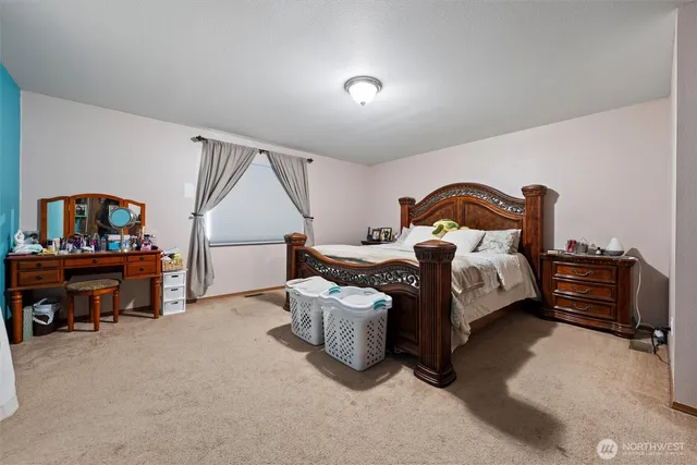 a view of walk in closet with clothes