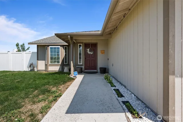 a view of a porch with a table and chair