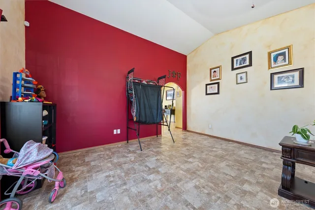 a living room with furniture a couch and a chandelier