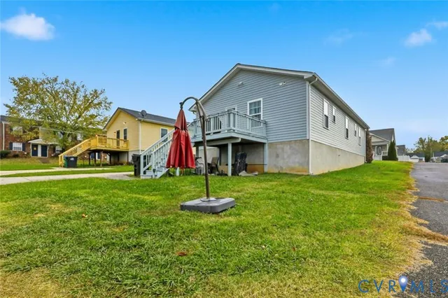 a view of roof deck with two chairs and a table