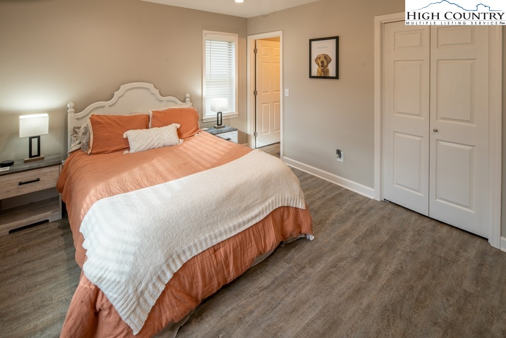 575 Townhomes Place, Unit 34 Boone, NC 28607 - Photo 13 of 32 a bed sitting in a bedroom next to a window