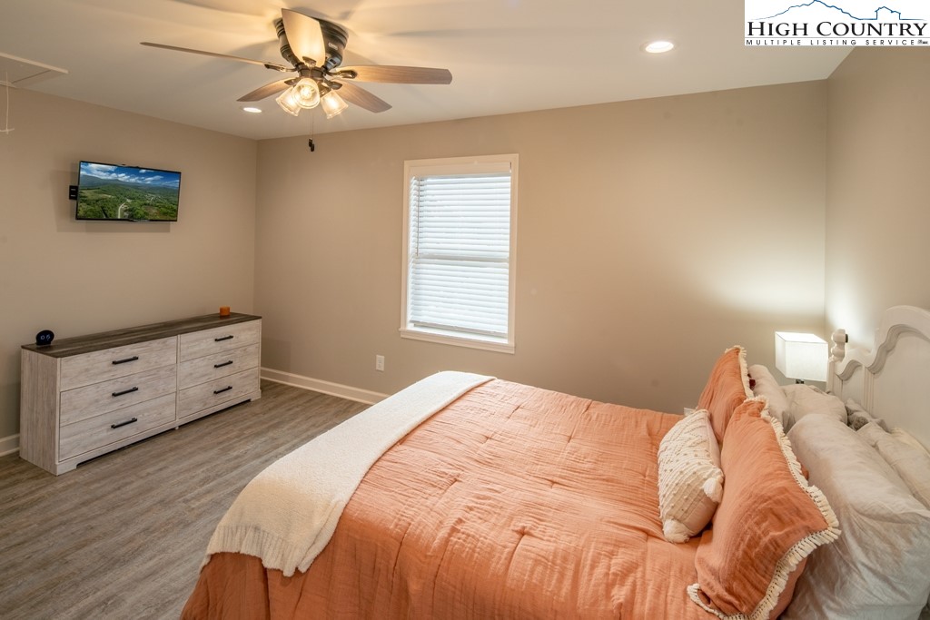 575 Townhomes Place, Unit 34 Boone, NC 28607 - Photo 14 of 32 a bedroom with a bed and a dresser