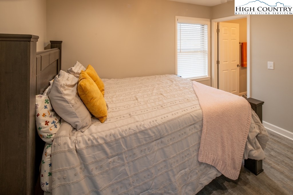 575 Townhomes Place, Unit 34 Boone, NC 28607 - Photo 18 of 32 a bedroom with a bed and a window