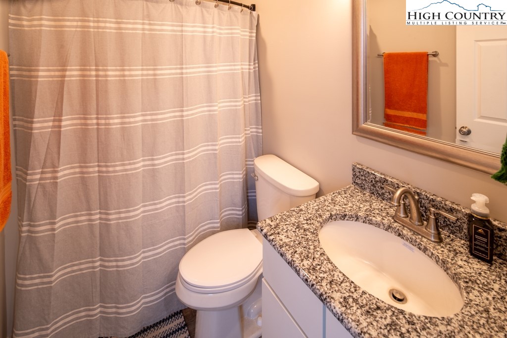 575 Townhomes Place, Unit 34 Boone, NC 28607 - Photo 21 of 32 a bathroom with a sink toilet and shower