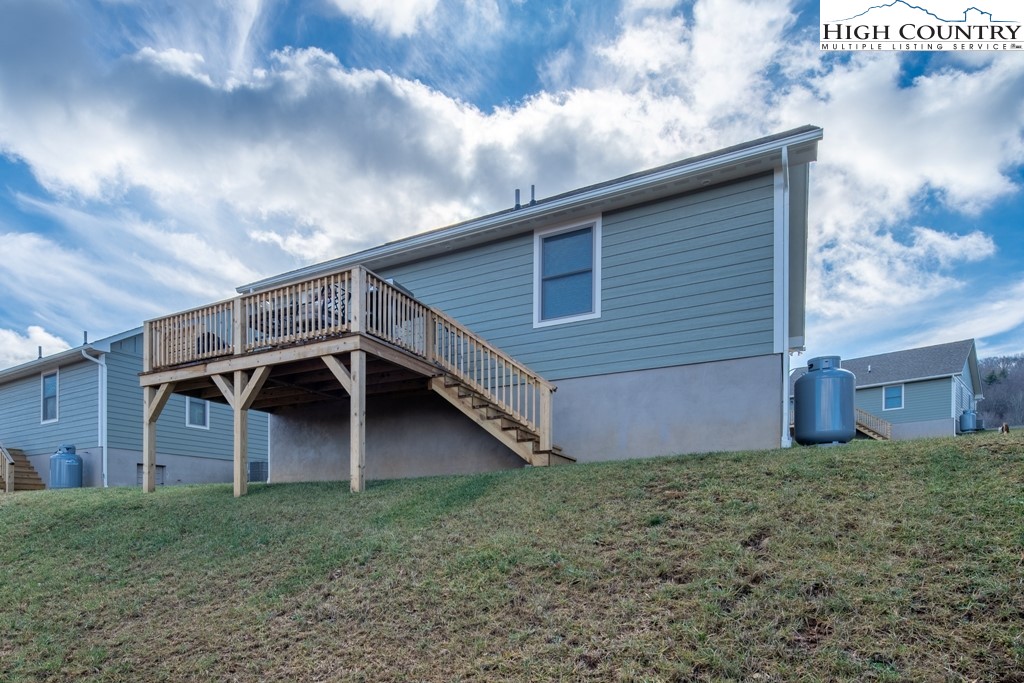 575 Townhomes Place, Unit 34 Boone, NC 28607 - Photo 26 of 32 a front view of house with yard