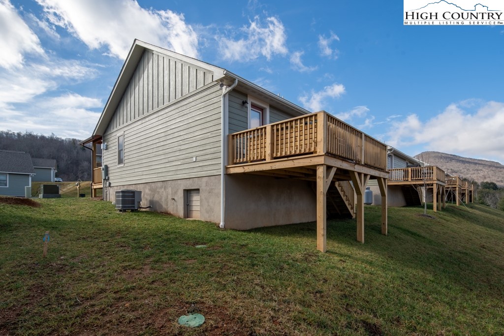 575 Townhomes Place, Unit 34 Boone, NC 28607 - Photo 28 of 32 a view of a house with a yard