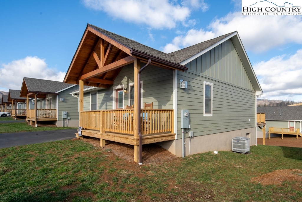 575 Townhomes Place, Unit 34 Boone, NC 28607 - Photo 29 of 32 a view of house with a yard