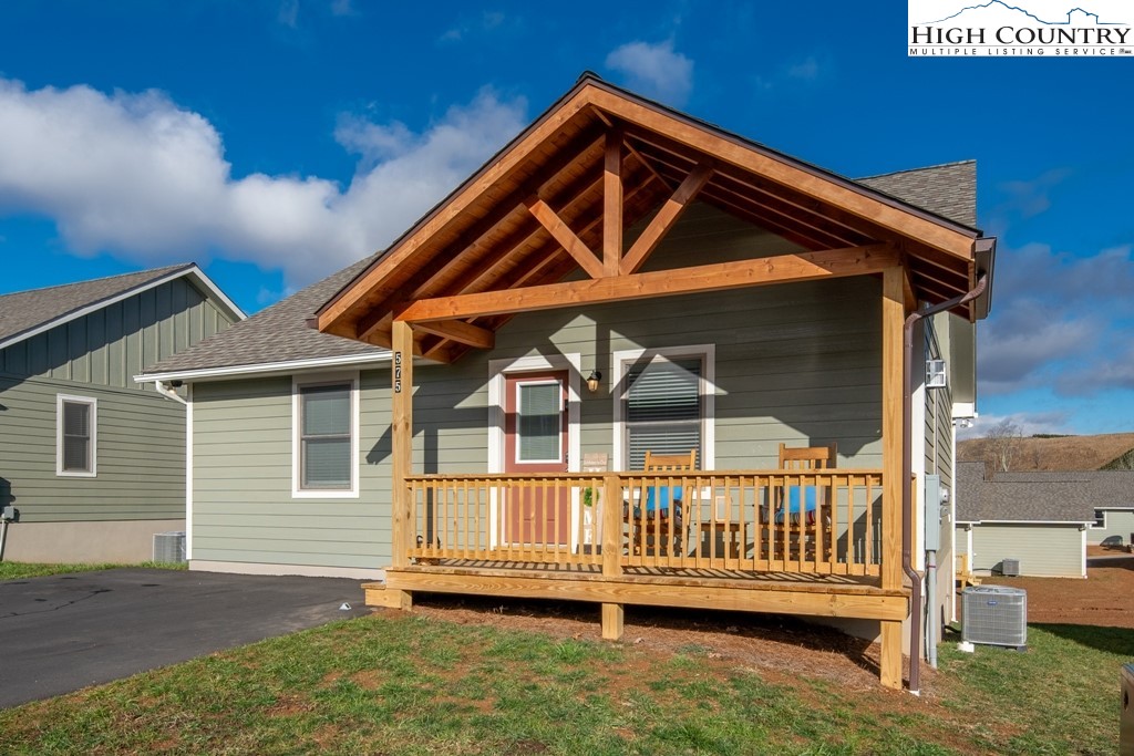 575 Townhomes Place, Unit 34 Boone, NC 28607 - Photo 30 of 32 a front view of a house with a yard