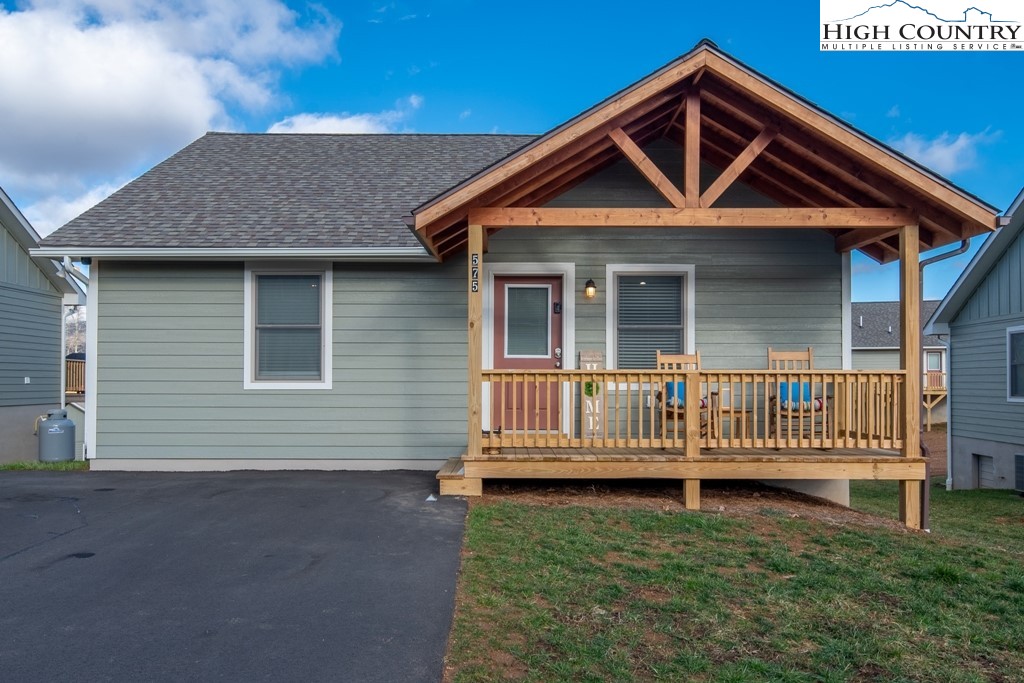575 Townhomes Place, Unit 34 Boone, NC 28607 - Photo 31 of 32 a front view of a house with a yard