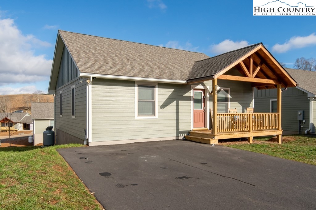 575 Townhomes Place, Unit 34 Boone, NC 28607 - Photo 32 of 32 a front view of a house with a yard