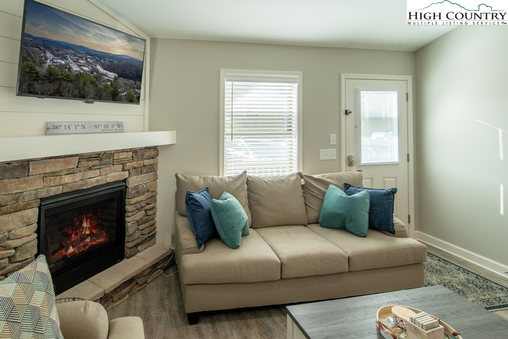 575 Townhomes Place, Unit 34 Boone, NC 28607 - Photo 4 of 32 a living room with furniture and a fireplace