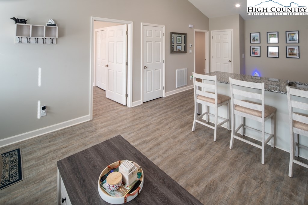 575 Townhomes Place, Unit 34 Boone, NC 28607 - Photo 5 of 32 a view of a dining room with furniture and wooden floor