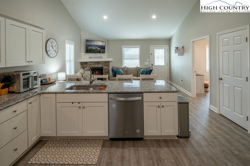 575 Townhomes Place, Unit 34 Boone, NC 28607 - Photo 7 of 32 a kitchen with sink cabinets and wooden floor