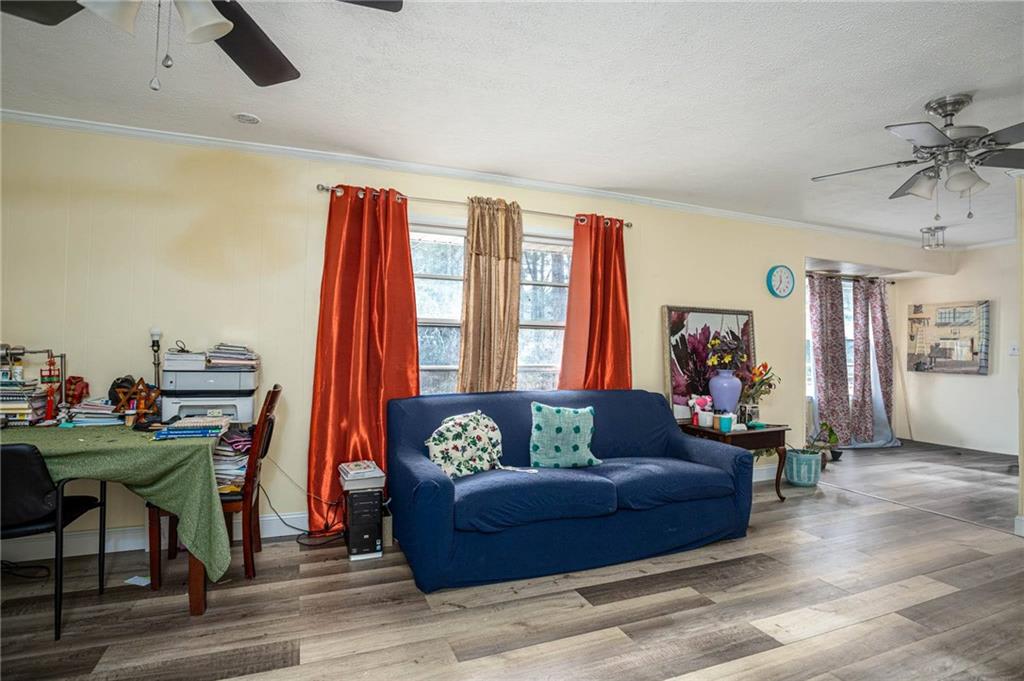 80 Stagecoach Circle Stockbridge, GA 30281 - Photo 11 of 38 a living room with furniture and a window