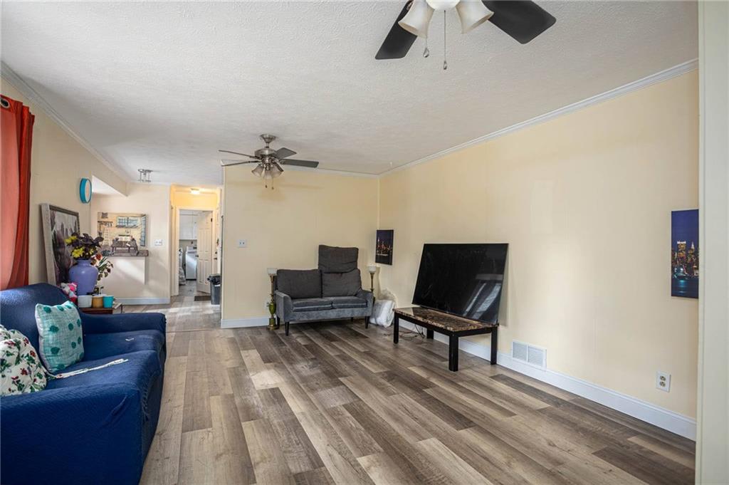 80 Stagecoach Circle Stockbridge, GA 30281 - Photo 12 of 38 a living room with furniture and a lamp
