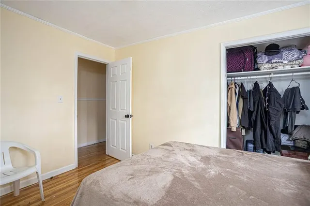 a view of a balcony with furniture and front door
