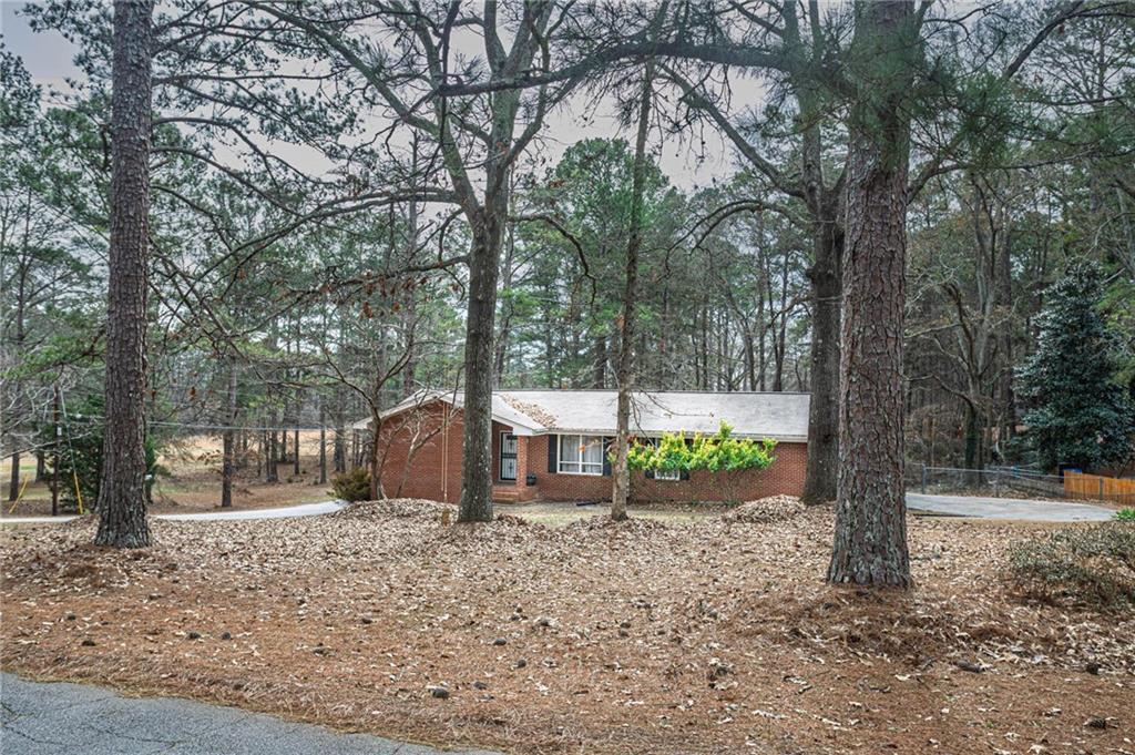 80 Stagecoach Circle Stockbridge, GA 30281 - Photo 2 of 38 a view of a house with backyard and tree