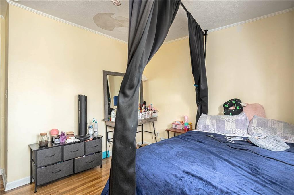 80 Stagecoach Circle Stockbridge, GA 30281 - Photo 21 of 38 a bed room with wooden floor and furniture