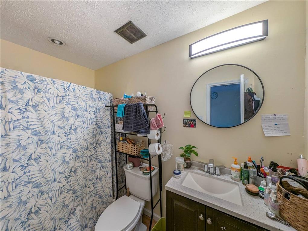80 Stagecoach Circle Stockbridge, GA 30281 - Photo 27 of 38 a bathroom with a sink mirror and toilet