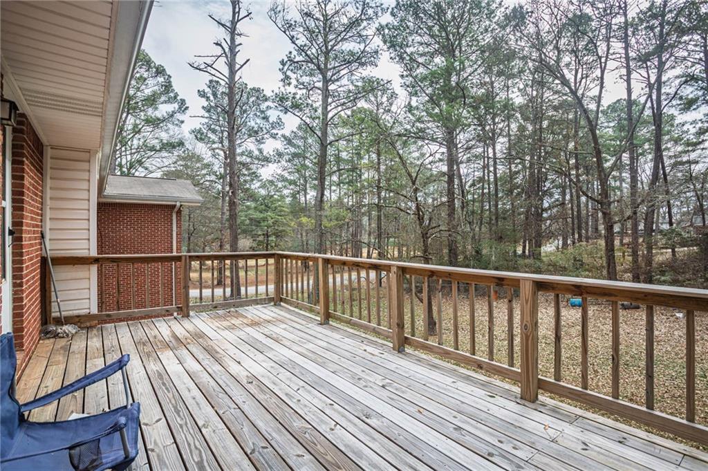 80 Stagecoach Circle Stockbridge, GA 30281 - Photo 32 of 38 a balcony with wooden floor and fence