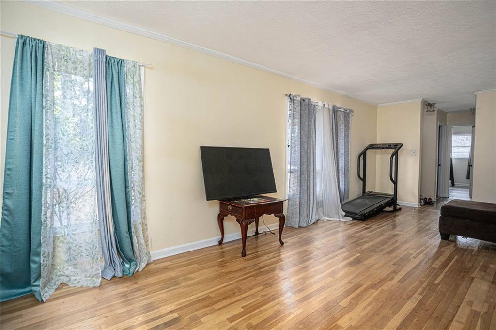 80 Stagecoach Circle Stockbridge, GA 30281 - Photo 5 of 38 a living room with furniture and a flat screen tv
