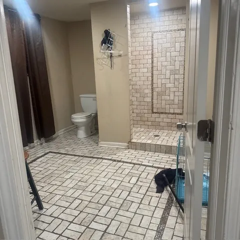 a living room with furniture and a shower