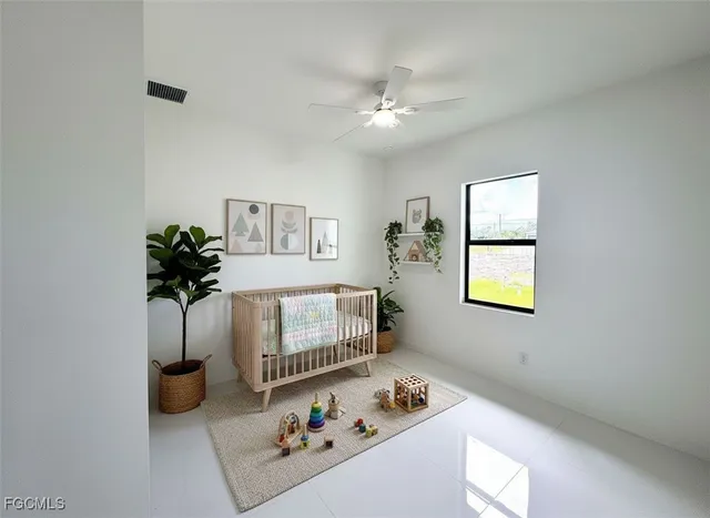 a bedroom with furniture and a potted plant