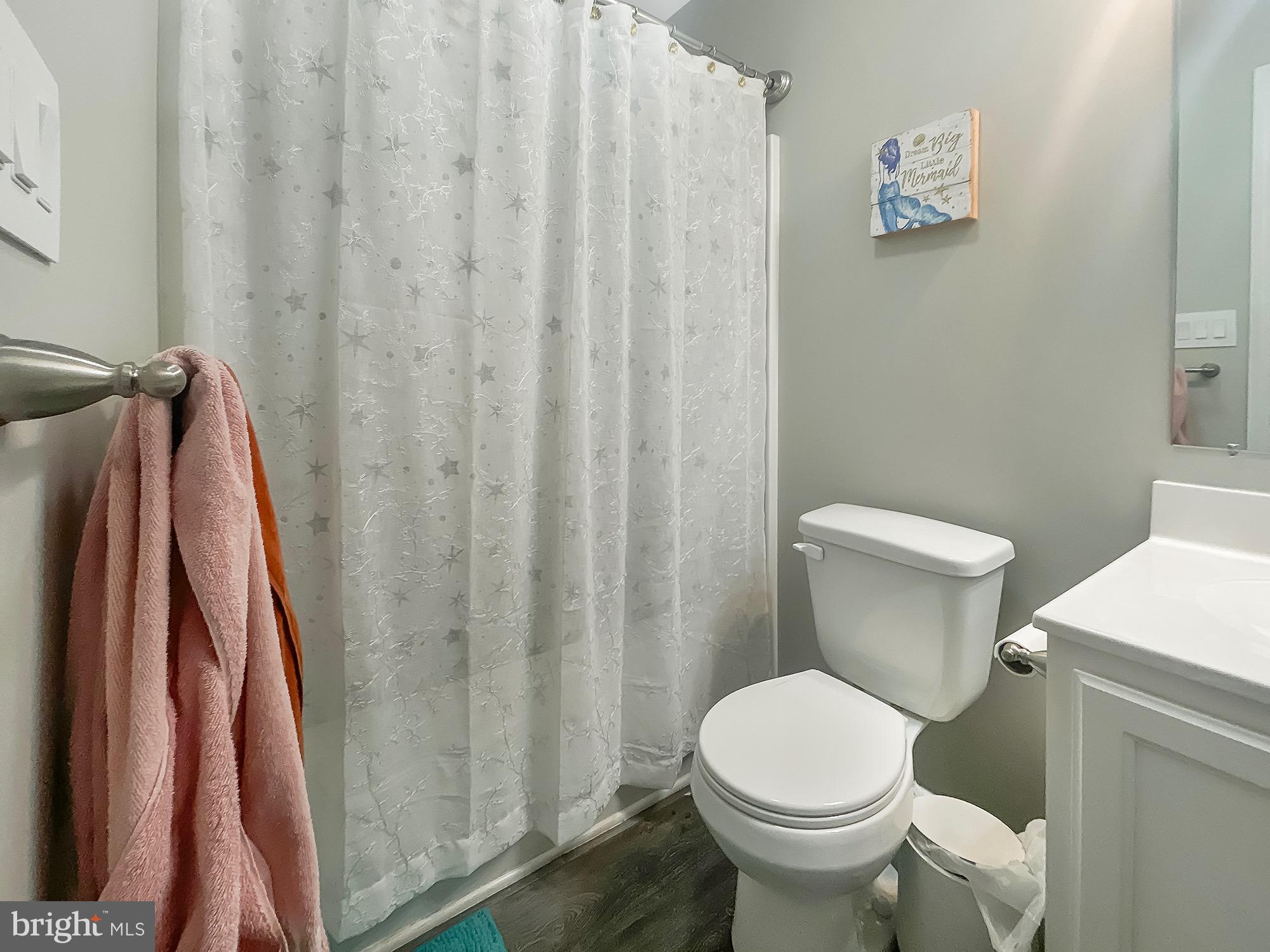 144 Overlook Dr. Hanover, PA 17331 - Photo 17 of 26 a white toilet sitting next to a shower curtain