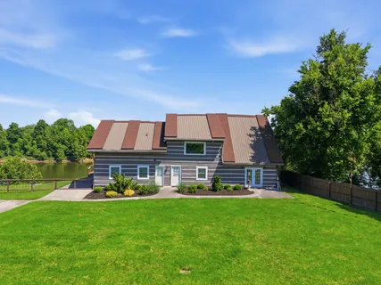 a view of a house with a big yard