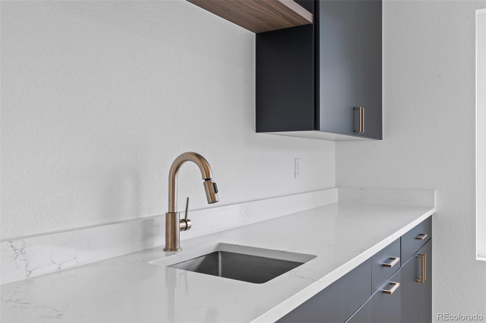 2451 Lawrence Street, Unit 2 Denver, CO 80205 - Photo 32 of 48 a close view of sink and tap