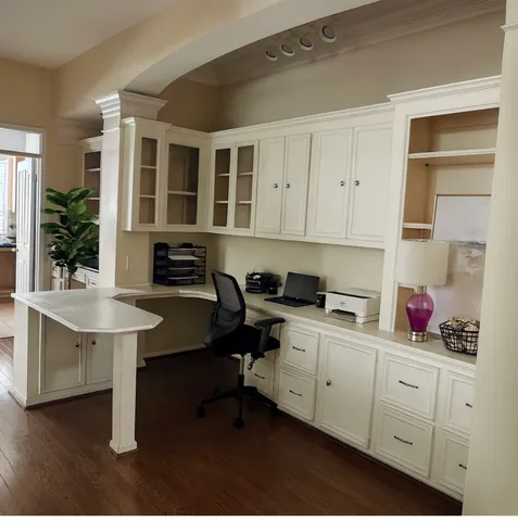 a view of a kitchen with cabinets