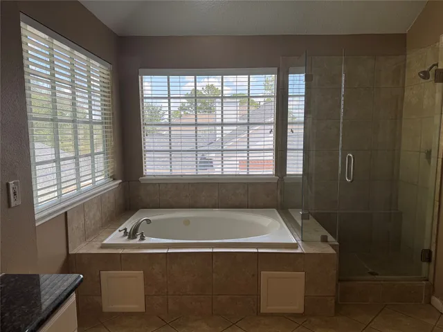 a bathroom with a bathtub and window
