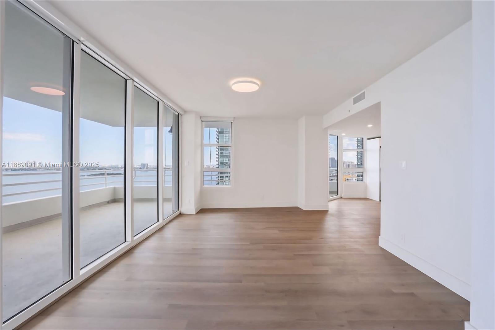 555 Northeast 34th Street, Unit 2607 Miami, FL 33137 - Photo 1 of 1 a view of an empty room with glass door